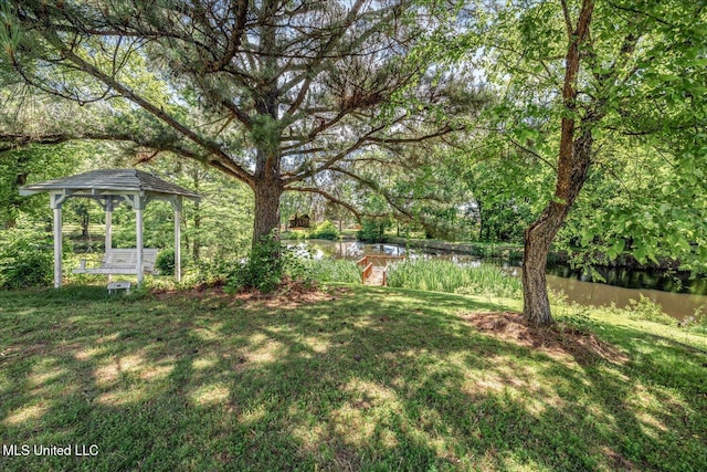 2185 Plum Point Rd, Southaven, MS 38672 - view of grassy yard with a gazebo and a water view