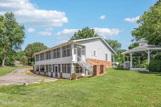 2185 Plum Point Rd, Southaven, MS 38672 - back of property featuring a sunroom, a gazebo, and a yard