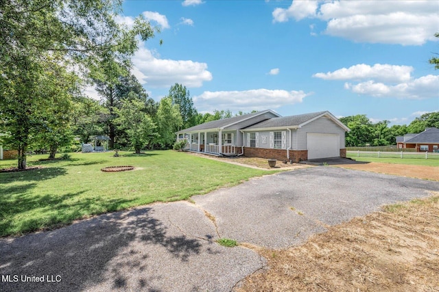 2185 Plum Point Rd, Southaven, MS 38672 - ranch-style home with a porch, brick siding, driveway, and a garage