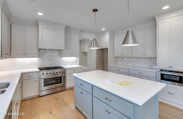 614 Cobalt Way, Brandon, MS 39042 - kitchen with pendant lighting, a center island, white cabinets, and appliances with stainless steel finishes