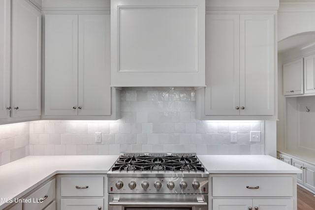 614 Cobalt Way, Brandon, MS 39042 - kitchen featuring stainless steel gas stove, tasteful backsplash, and white cabinets