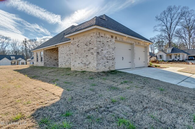 614 Cobalt Way, Brandon, MS 39042 - view of home's exterior with a garage and a yard