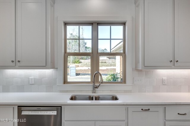 614 Cobalt Way, Brandon, MS 39042 - kitchen featuring white cabinetry, sink, stainless steel dishwasher, and backsplash