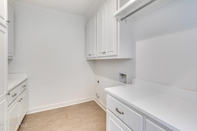 614 Cobalt Way, Brandon, MS 39042 - clothes washing area with cabinets, ornamental molding, electric dryer hookup, and washer hookup