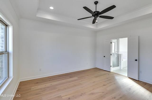 614 Cobalt Way, Brandon, MS 39042 - spare room with a raised ceiling, crown molding, ceiling fan, and light wood-type flooring