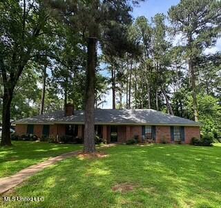 101 Dogwood Cir, Brandon, MS 39047 - single story home with a front lawn and a chimney