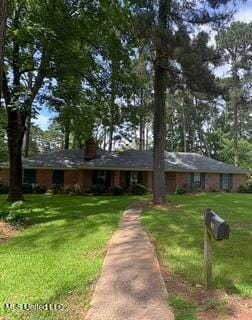 101 Dogwood Cir, Brandon, MS 39047 - ranch-style house featuring a front lawn and a chimney