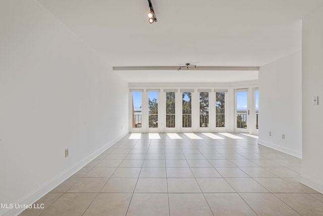 empty room with light tile patterned flooring