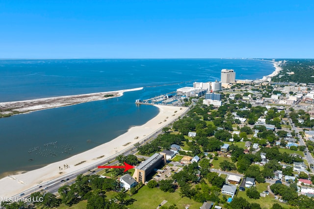 birds eye view of property featuring a view of the beach and a water view