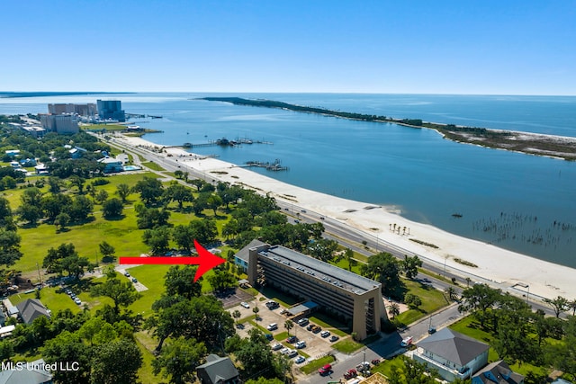 bird's eye view with a water view and a view of the beach