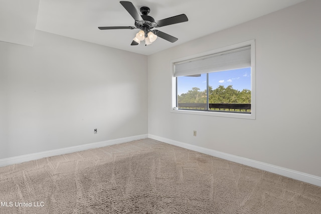 empty room with carpet flooring and ceiling fan