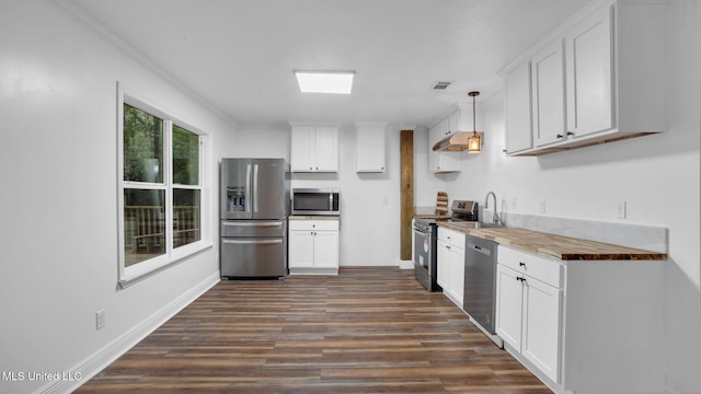 9083 Old River Rd Lot 1, Petal, MS 39465 - kitchen featuring appliances with stainless steel finishes, dark wood-type flooring, white cabinets, baseboards, and decorative light fixtures