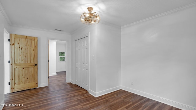 9083 Old River Rd Lot 1, Petal, MS 39465 - empty room with dark wood-style flooring, baseboards, a chandelier, and crown molding