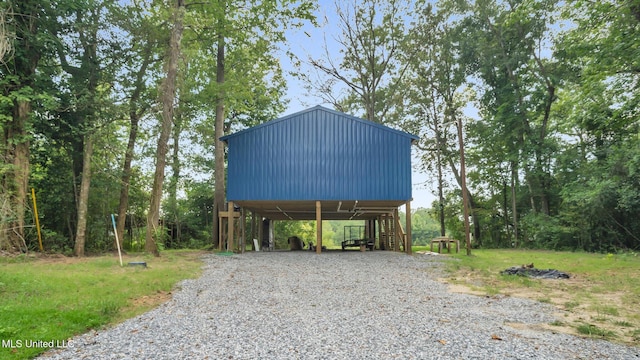 9083 Old River Rd Lot 1, Petal, MS 39465 - view of outbuilding featuring driveway, a carport, and stairs