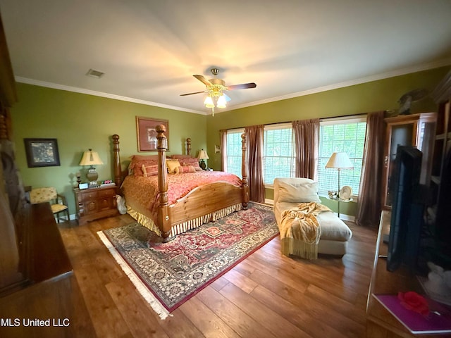 26 Woodgate Dr, Brandon, MS 39042 - bedroom with crown molding, a ceiling fan, visible vents, and hardwood / wood-style floors