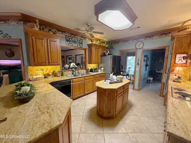 26 Woodgate Dr, Brandon, MS 39042 - kitchen featuring a kitchen island, backsplash, a sink, stainless steel appliances, and light tile patterned flooring