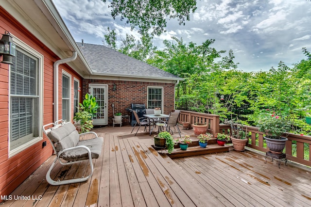 26 Woodgate Dr, Brandon, MS 39042 - wooden deck featuring outdoor dining area and a grill