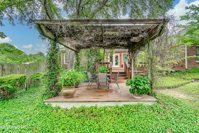 26 Woodgate Dr, Brandon, MS 39042 - view of outbuilding featuring a pergola, fence, and outdoor dining area