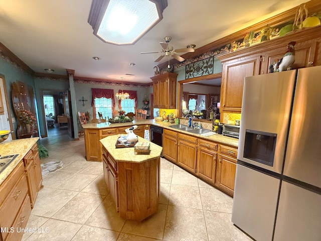 26 Woodgate Dr, Brandon, MS 39042 - kitchen with a peninsula, a kitchen island, stainless steel fridge with ice dispenser, a sink, and dishwasher