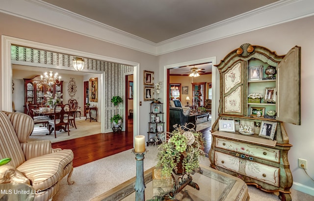 26 Woodgate Dr, Brandon, MS 39042 - sitting room featuring carpet floors, baseboards, a notable chandelier, and ornamental molding