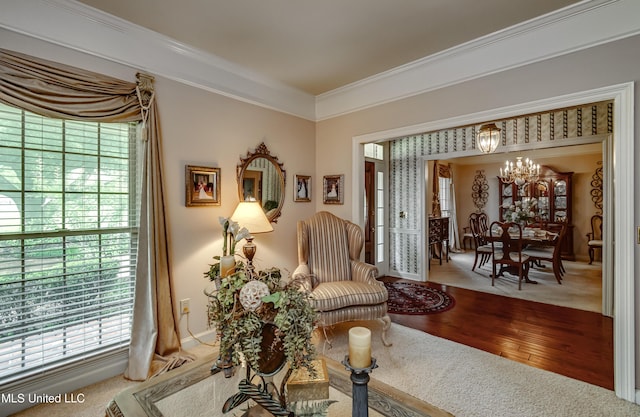 26 Woodgate Dr, Brandon, MS 39042 - sitting room with an inviting chandelier, crown molding, and a healthy amount of sunlight
