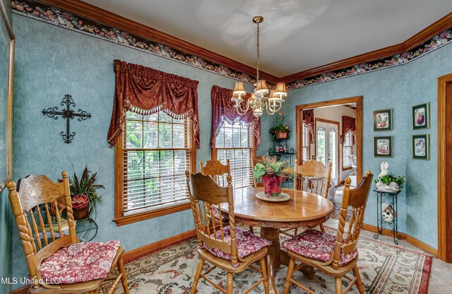 26 Woodgate Dr, Brandon, MS 39042 - dining space featuring an inviting chandelier, baseboards, and crown molding