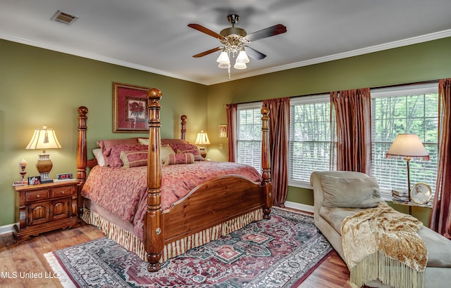 26 Woodgate Dr, Brandon, MS 39042 - bedroom with crown molding, ceiling fan, light wood finished floors, baseboards, and visible vents