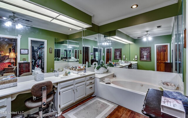 26 Woodgate Dr, Brandon, MS 39042 - bathroom with crown molding, a ceiling fan, a bath, and wood finished floors