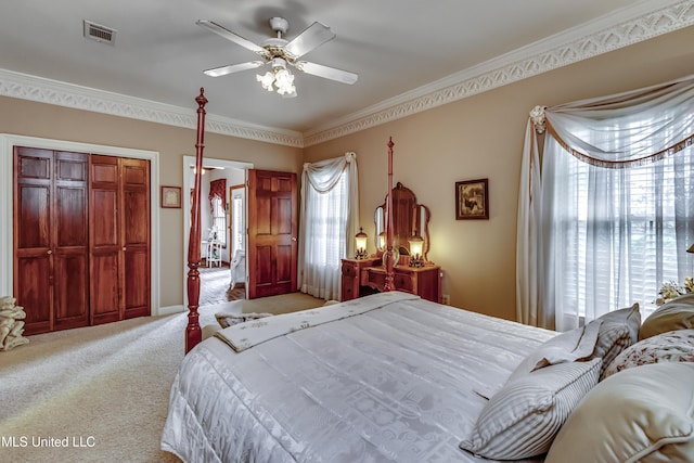 26 Woodgate Dr, Brandon, MS 39042 - bedroom featuring visible vents, a closet, ornamental molding, ceiling fan, and carpet flooring