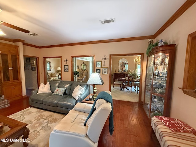26 Woodgate Dr, Brandon, MS 39042 - living room with visible vents, ornamental molding, ceiling fan, and wood finished floors