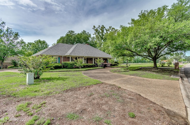 26 Woodgate Dr, Brandon, MS 39042 - single story home featuring brick siding, roof with shingles, and a front lawn