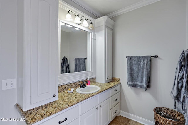 bathroom featuring ornamental molding, vanity, and tile patterned flooring