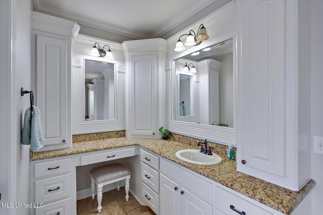 bathroom featuring vanity, ornamental molding, and tile patterned floors