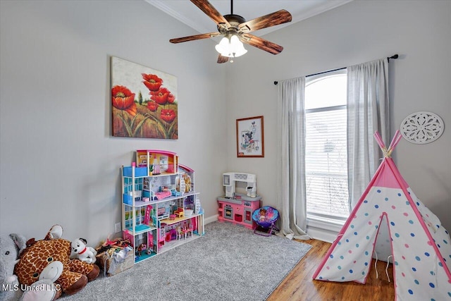 game room featuring crown molding, ceiling fan, and wood-type flooring