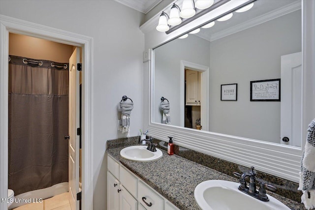 bathroom with vanity, crown molding, and walk in shower