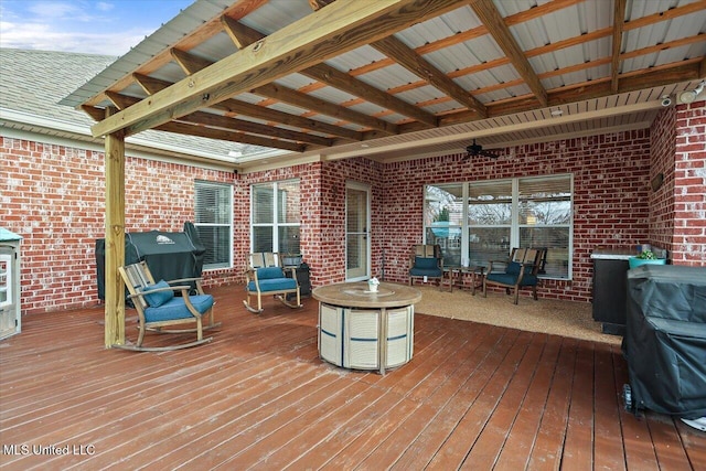 deck featuring a grill and ceiling fan