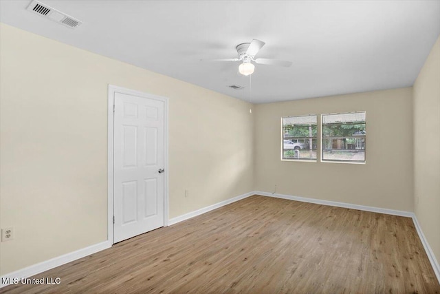 empty room featuring light hardwood / wood-style floors and ceiling fan