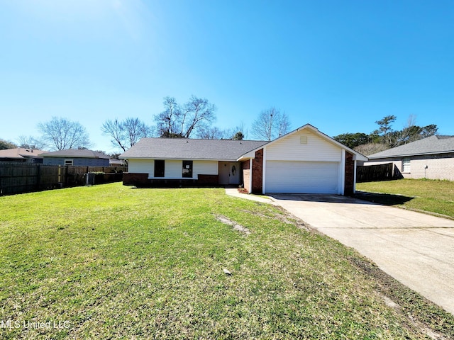 view of front facade with driveway, brick siding, a front yard, and fence