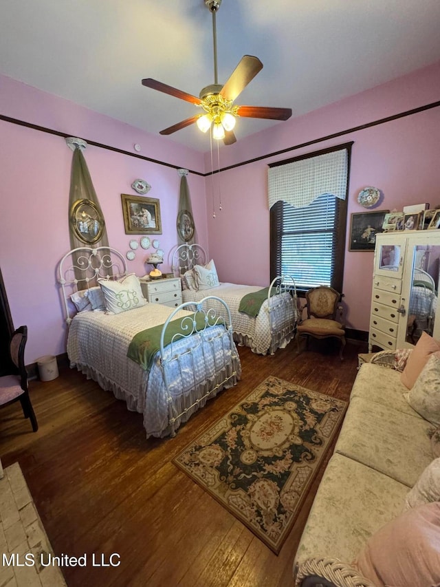 bedroom with hardwood / wood-style flooring and ceiling fan