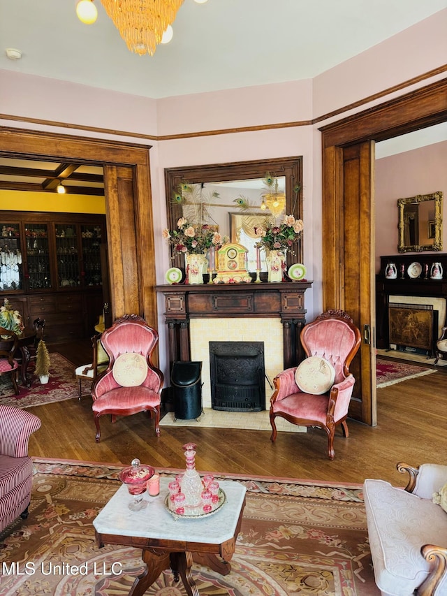 living room with a chandelier and wood-type flooring