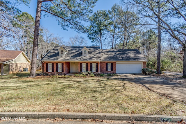 view of front facade with a garage and a front lawn