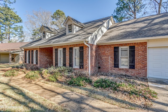 view of side of home with a garage