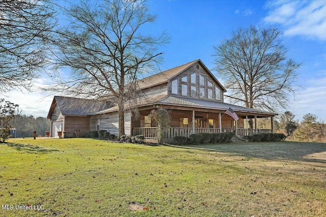 view of front facade with a porch, a garage, and a front yard