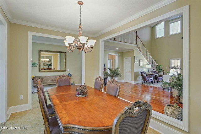 dining room with ornamental molding, an inviting chandelier, and a healthy amount of sunlight