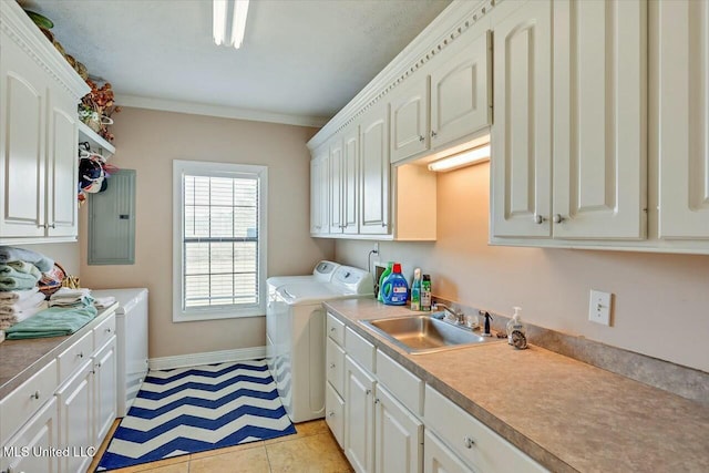 clothes washing area with cabinets, washer and clothes dryer, crown molding, sink, and electric panel