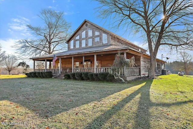 farmhouse inspired home with central AC, a porch, and a front yard