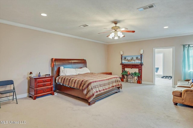 carpeted bedroom with ceiling fan and ornamental molding