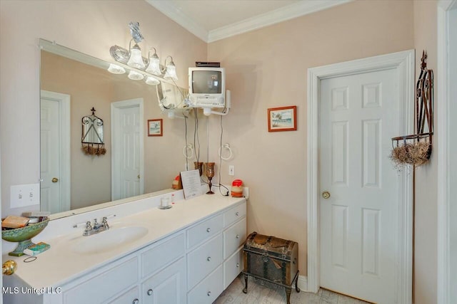 bathroom featuring hardwood / wood-style flooring, vanity, and crown molding