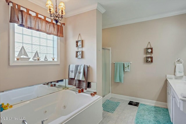 bathroom featuring a chandelier, shower with separate bathtub, vanity, and ornamental molding