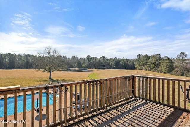 wooden deck with a rural view